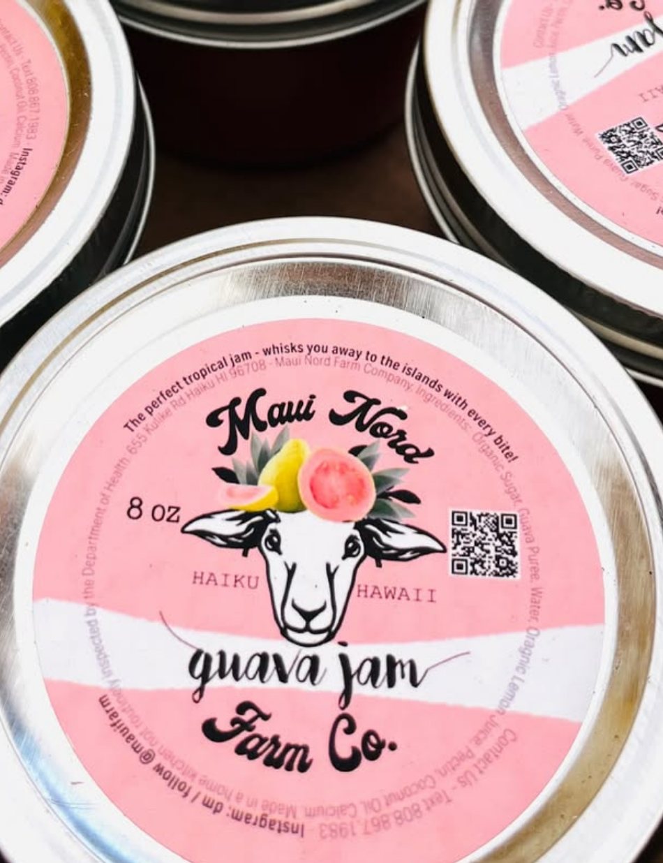 A jar lid printed with the Maui Nord sheep, a guava, and the words guava jam.